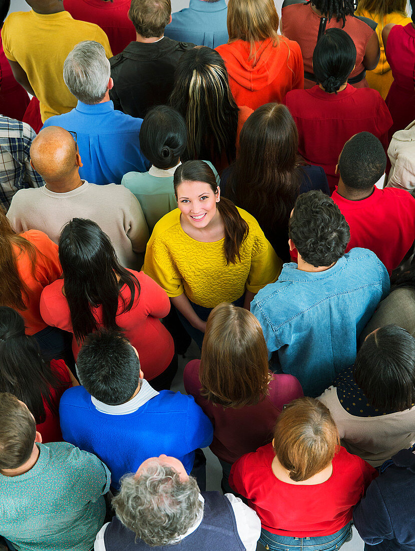 Smiling woman in crowd