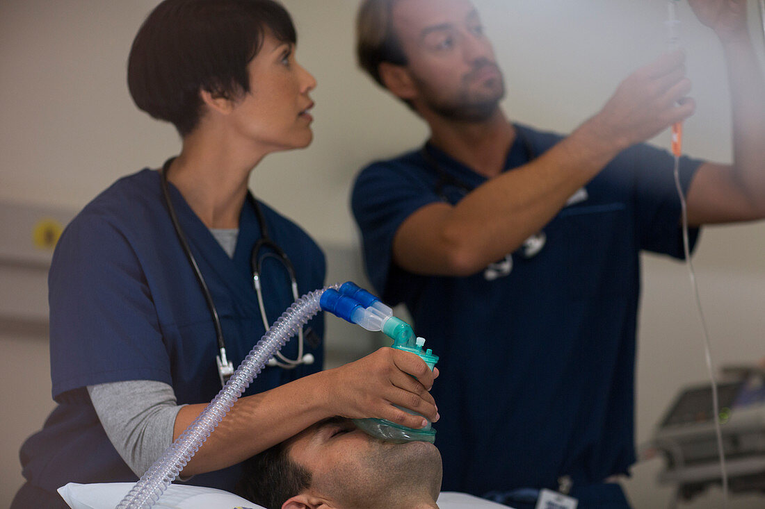 Doctor holding oxygen mask