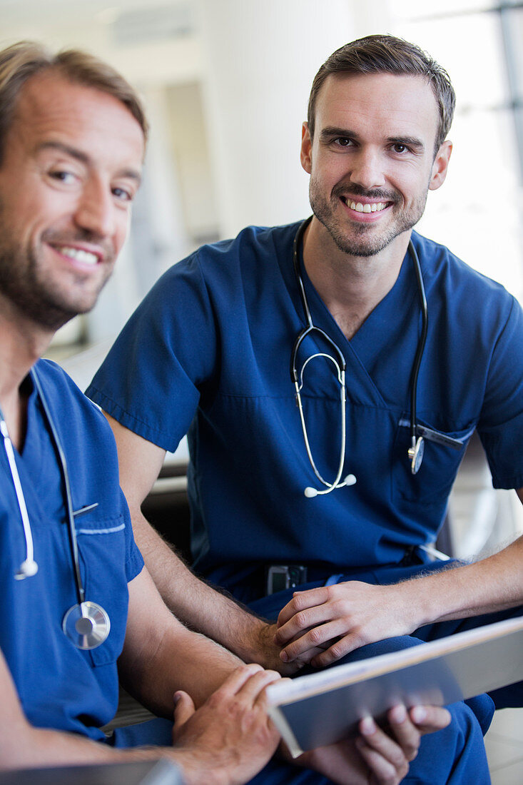 Portrait of two doctorss around necks