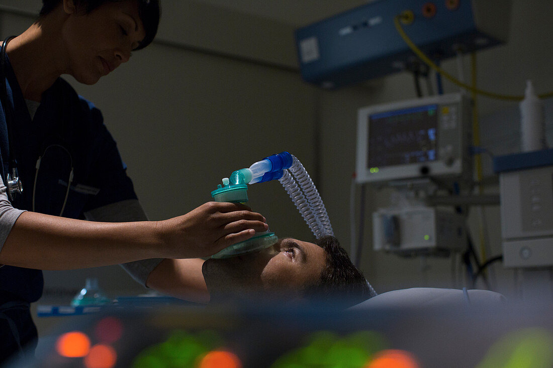 Doctor holding oxygen mask