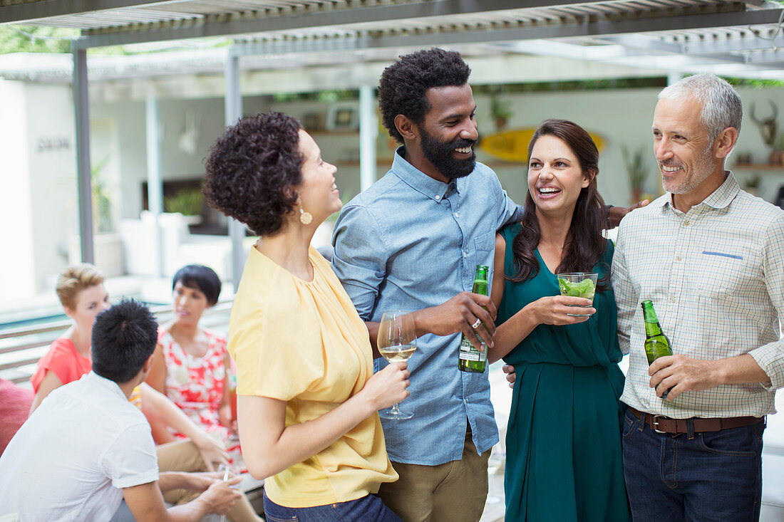 Friends talking at party