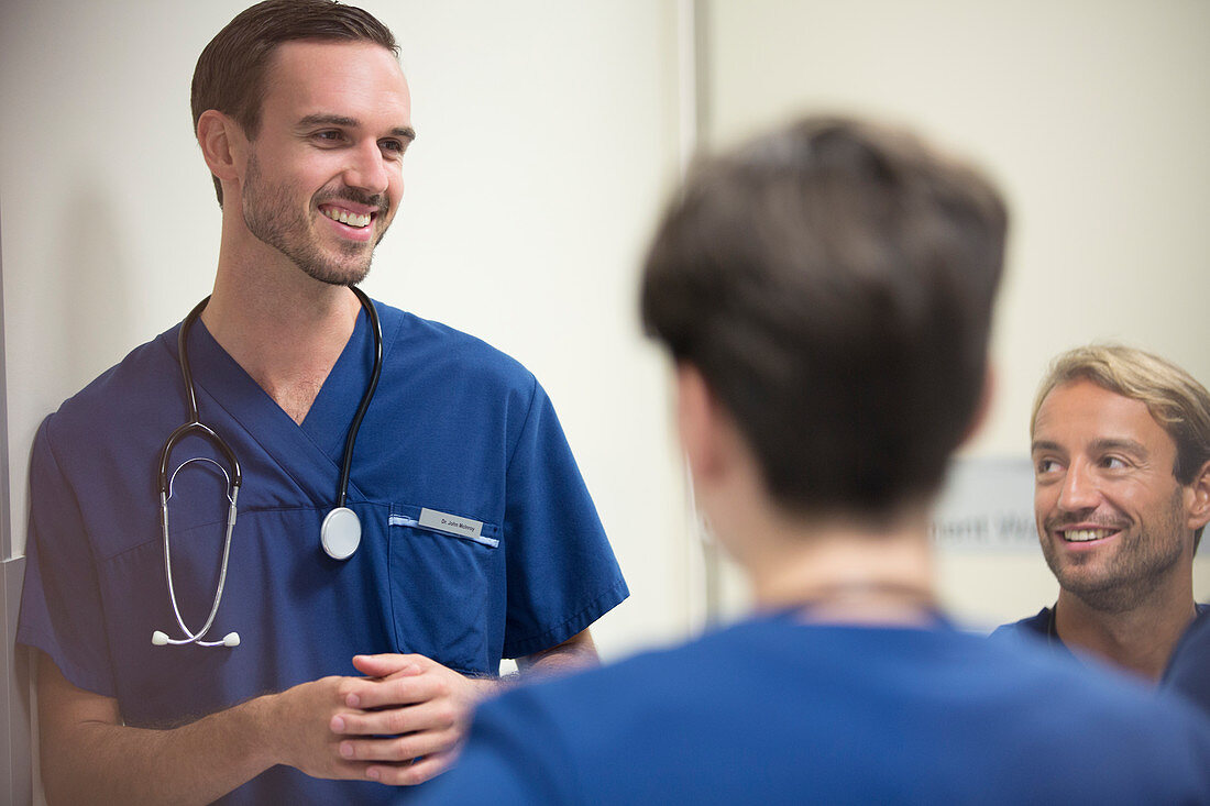 Doctors smiling and talking ward