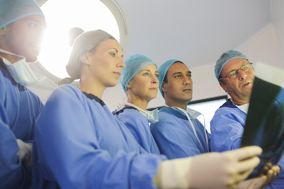 Surgeons looking at x-ray