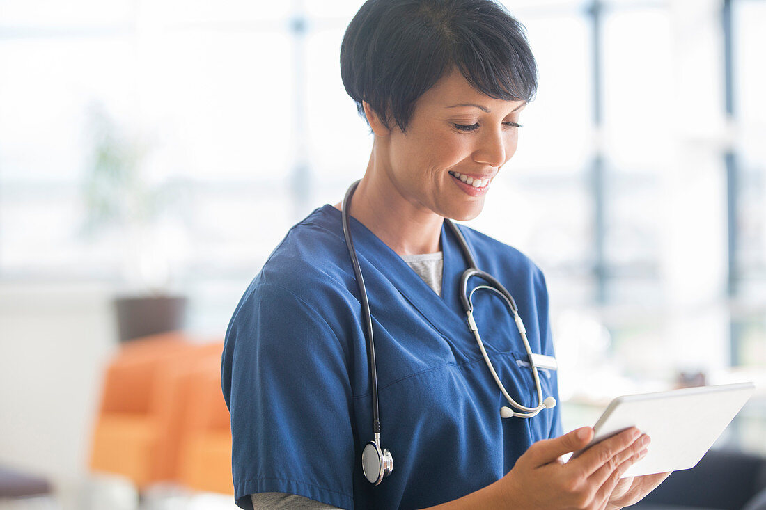 Female doctor using tablet pc in hospital