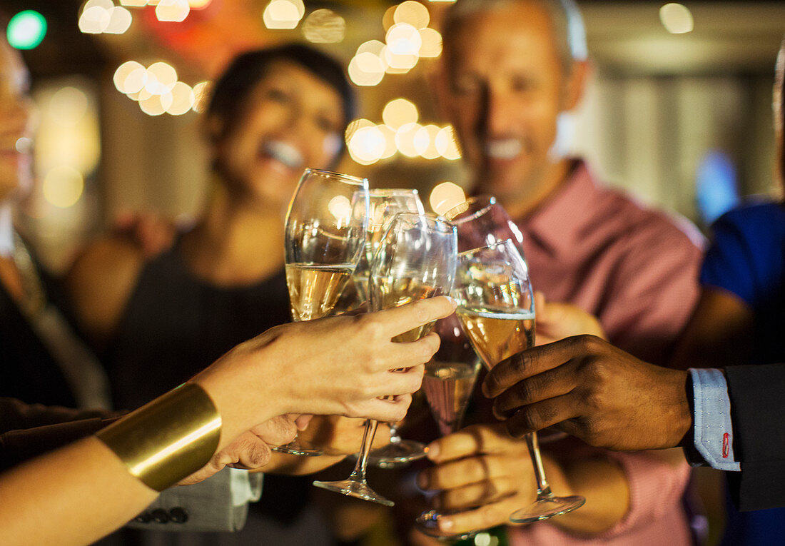 Friends toasting each other at party