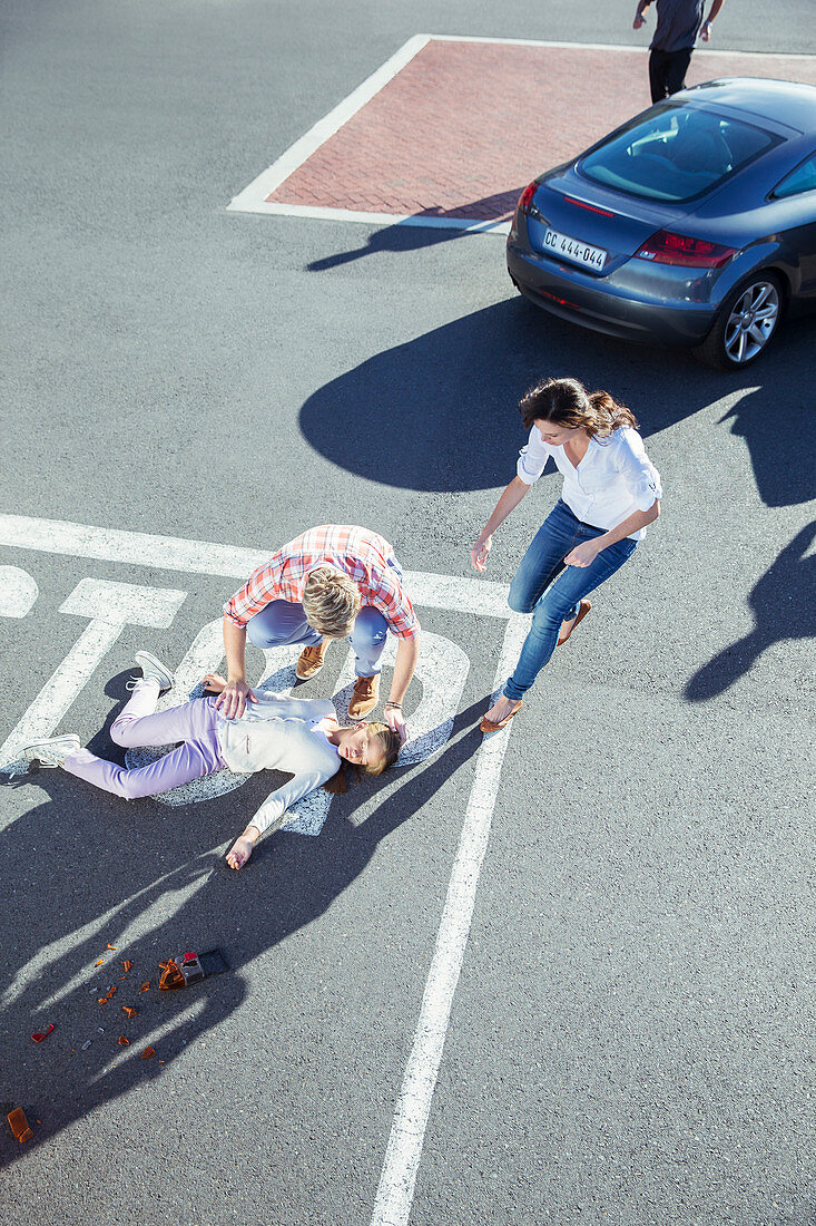 People rushing to injured girl on street