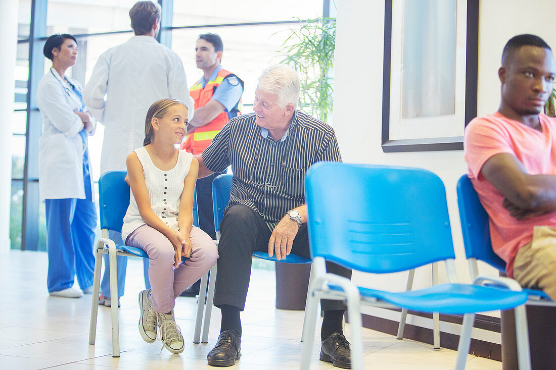 Man and granddaughter sitting