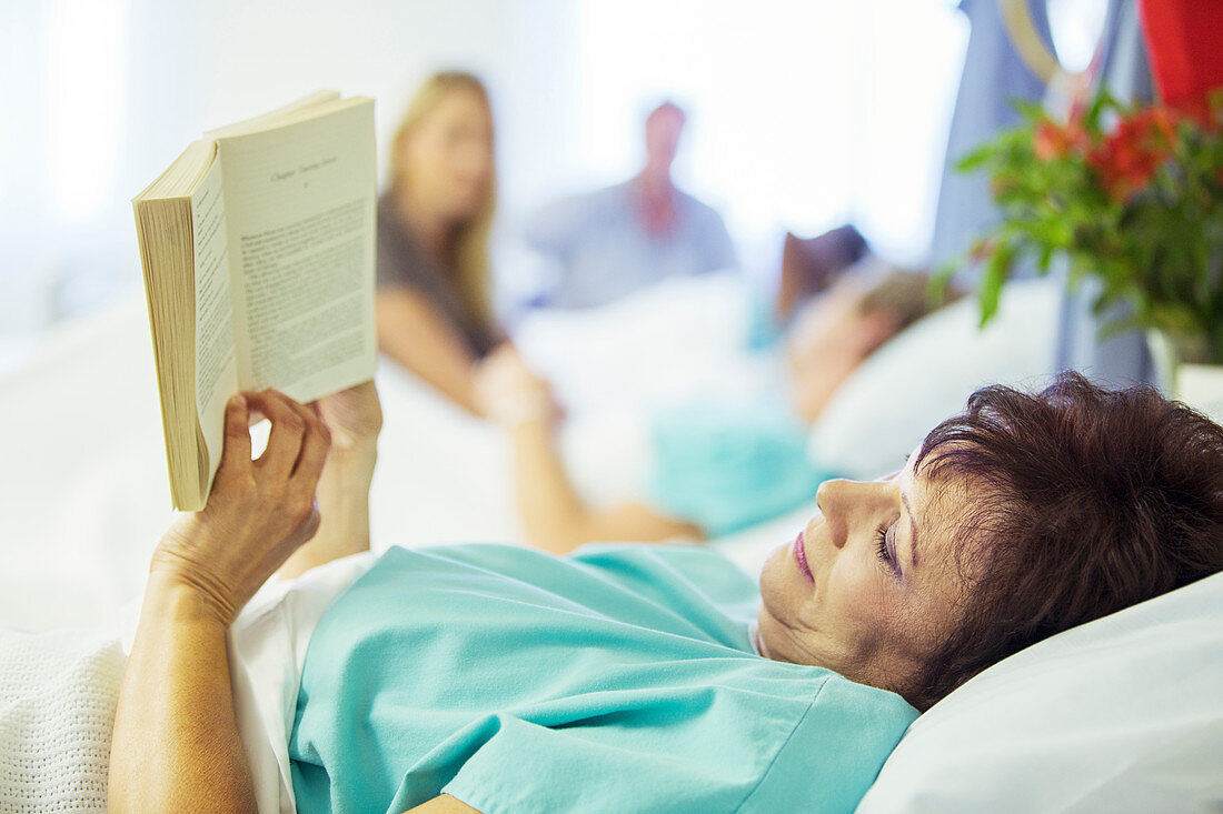Patient reading in hospital room