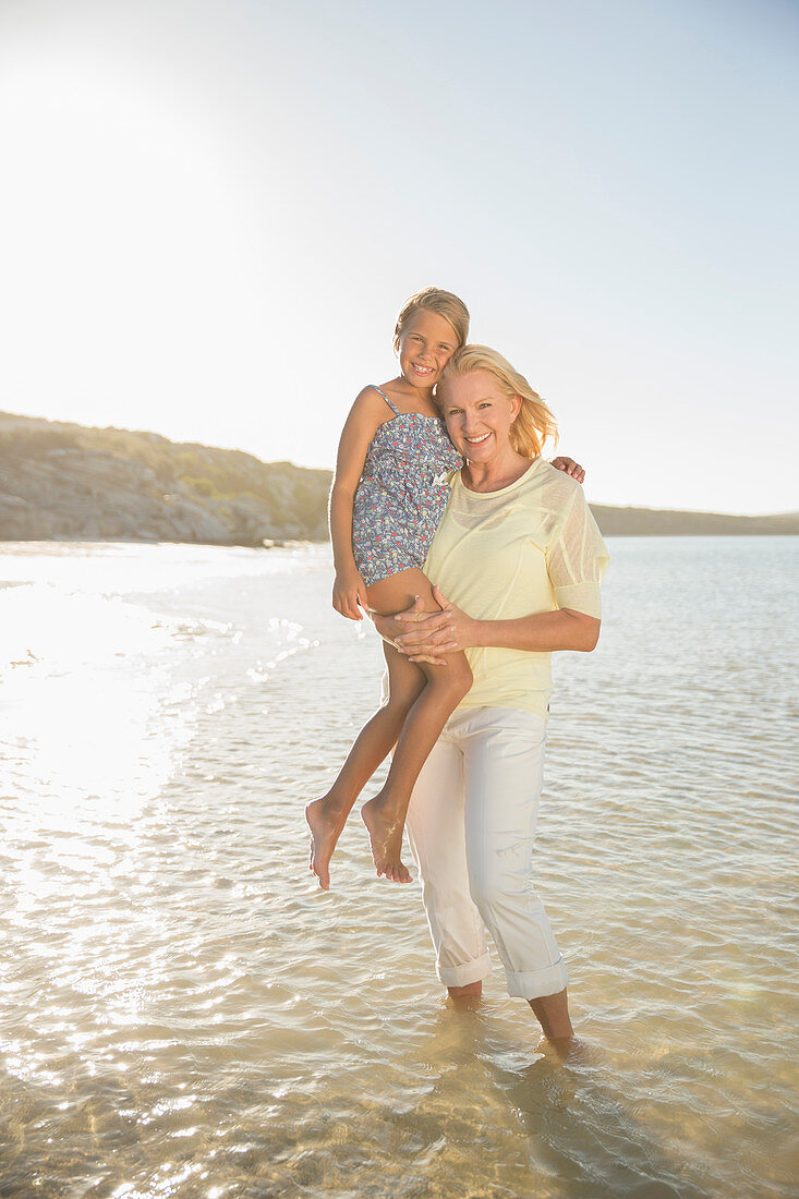 Grandmother holding granddaughter