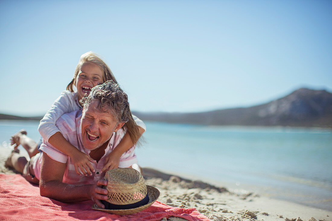 Grandfather and granddaughter playing