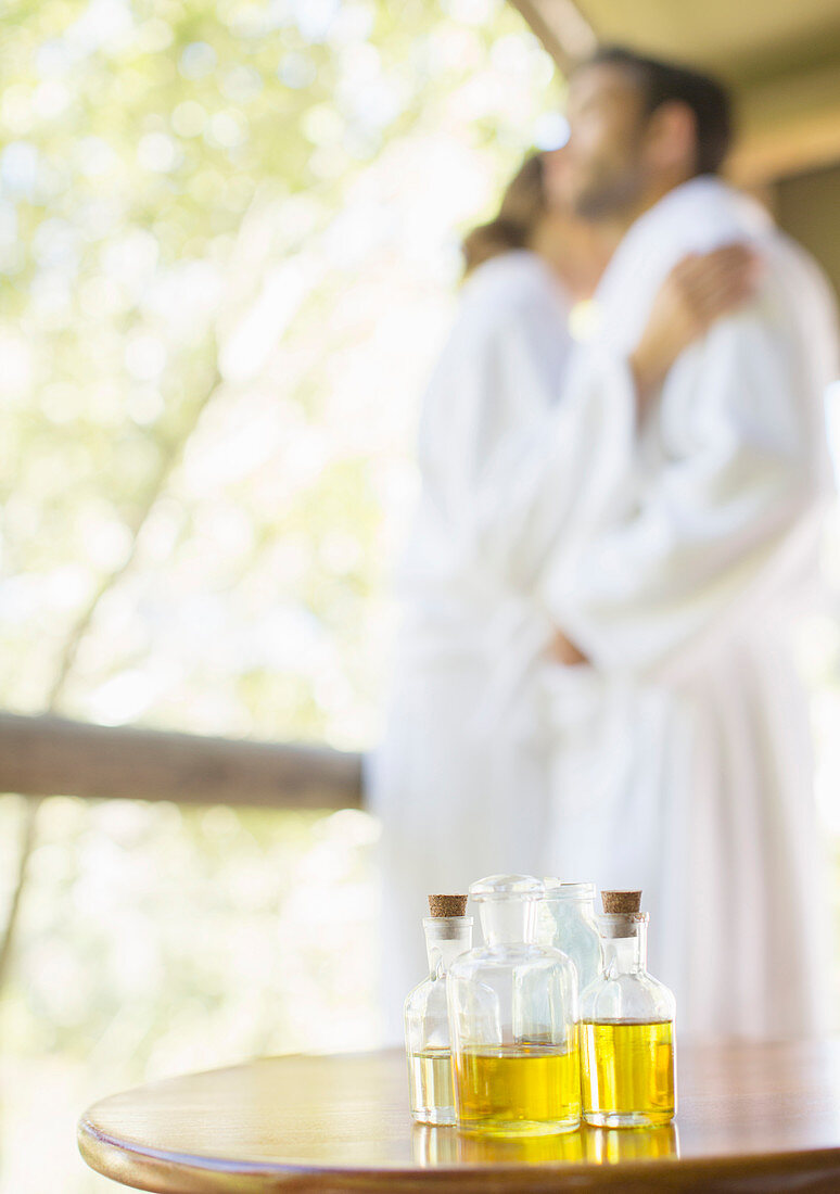 Bottles of massage oil on side table