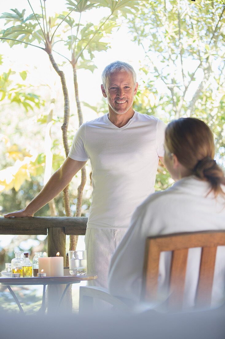 Couple relaxing together on balcony