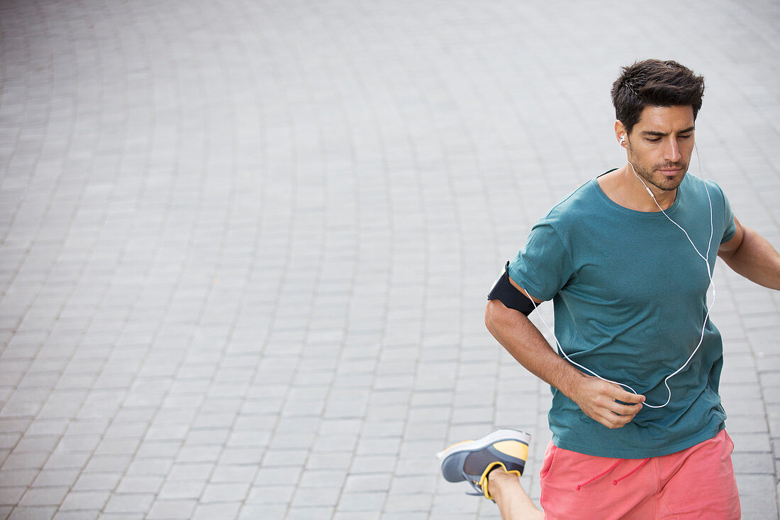 Man running through city streets