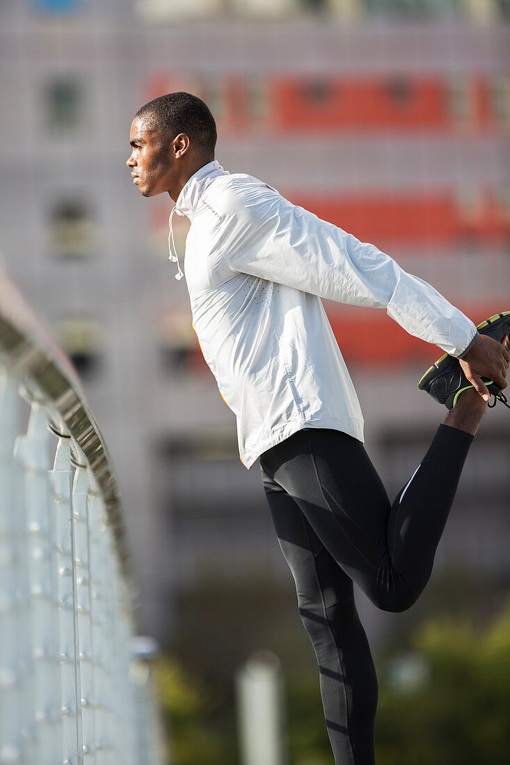 Man stretching his legs before exercising