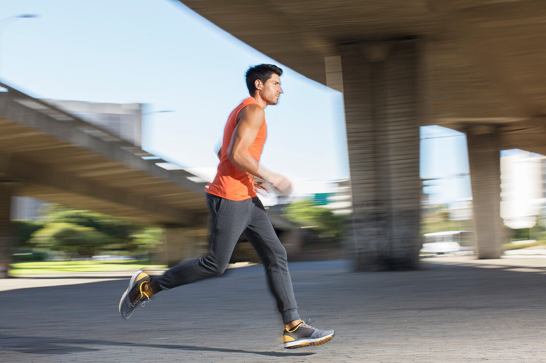 Man running through city streets