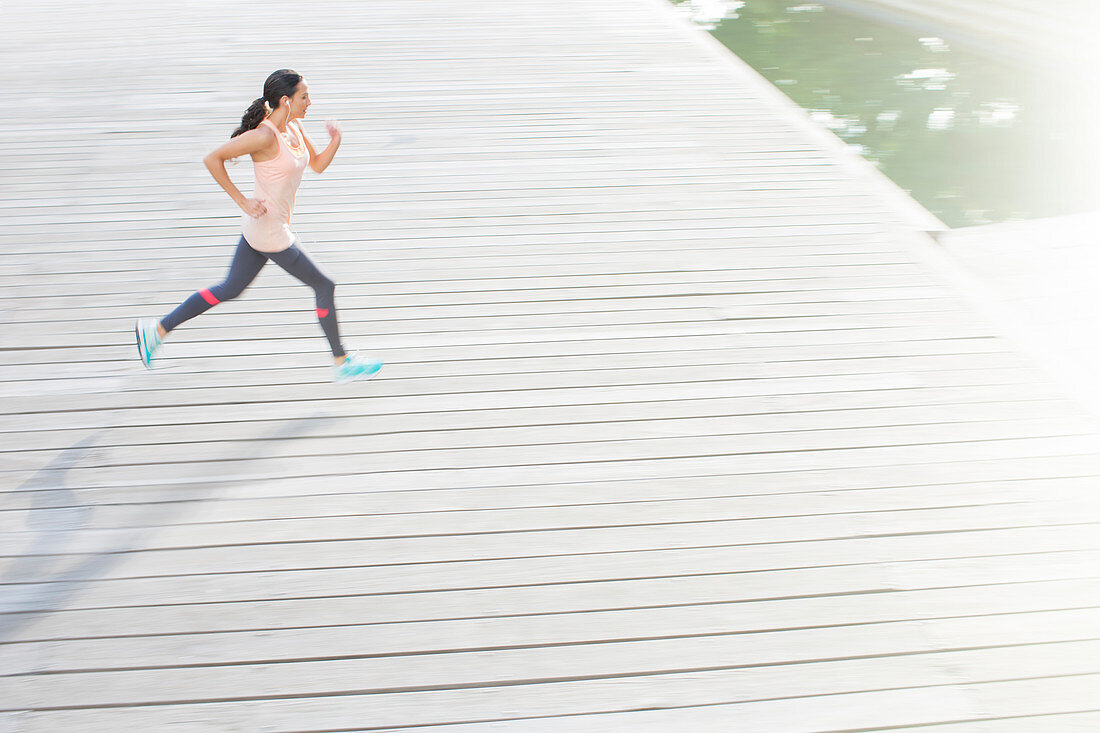 Woman running through city streets