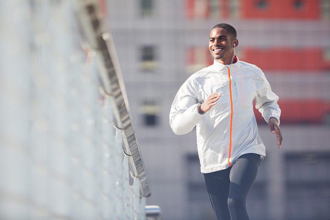 Man running through city streets