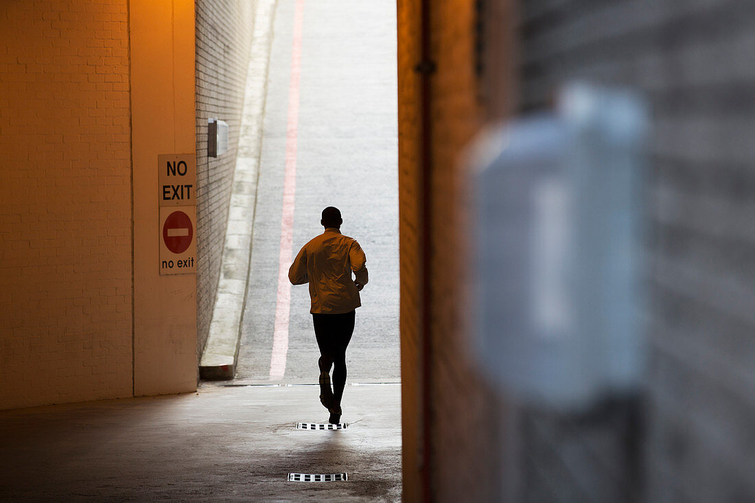 Man running through city streets