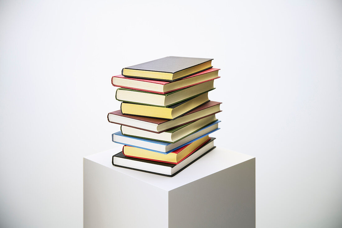 Stack of books on pedestal