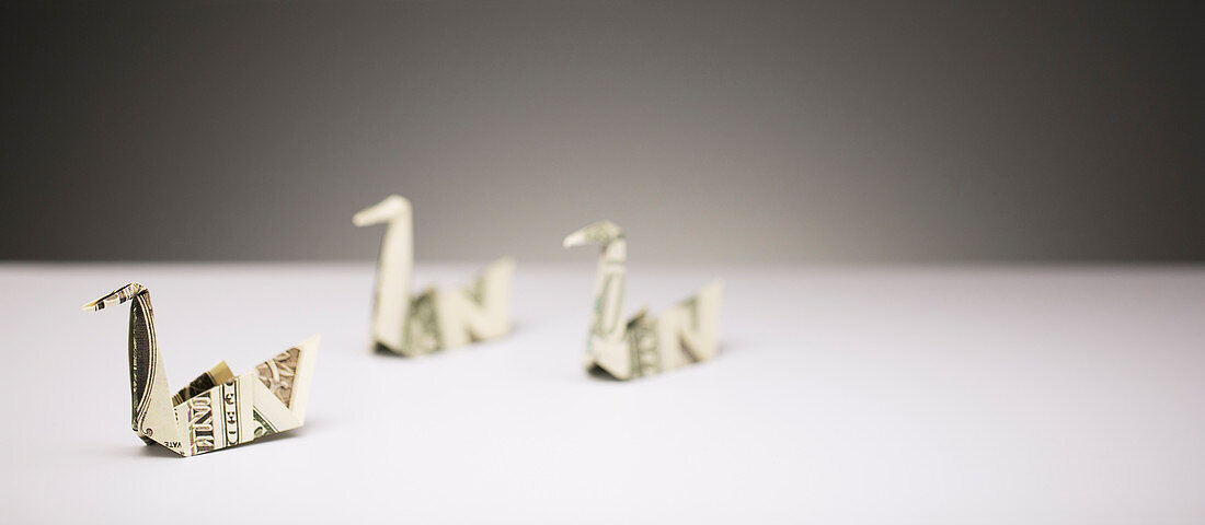 Origami swans made of dollar bills