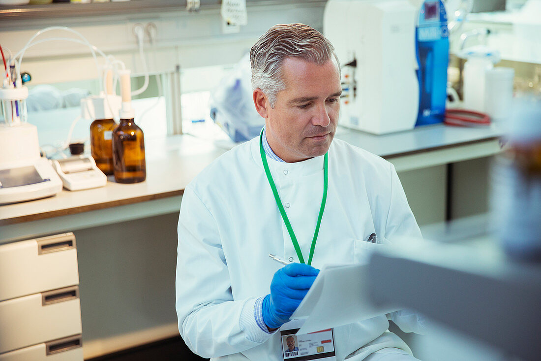 Scientist taking notes on experiment