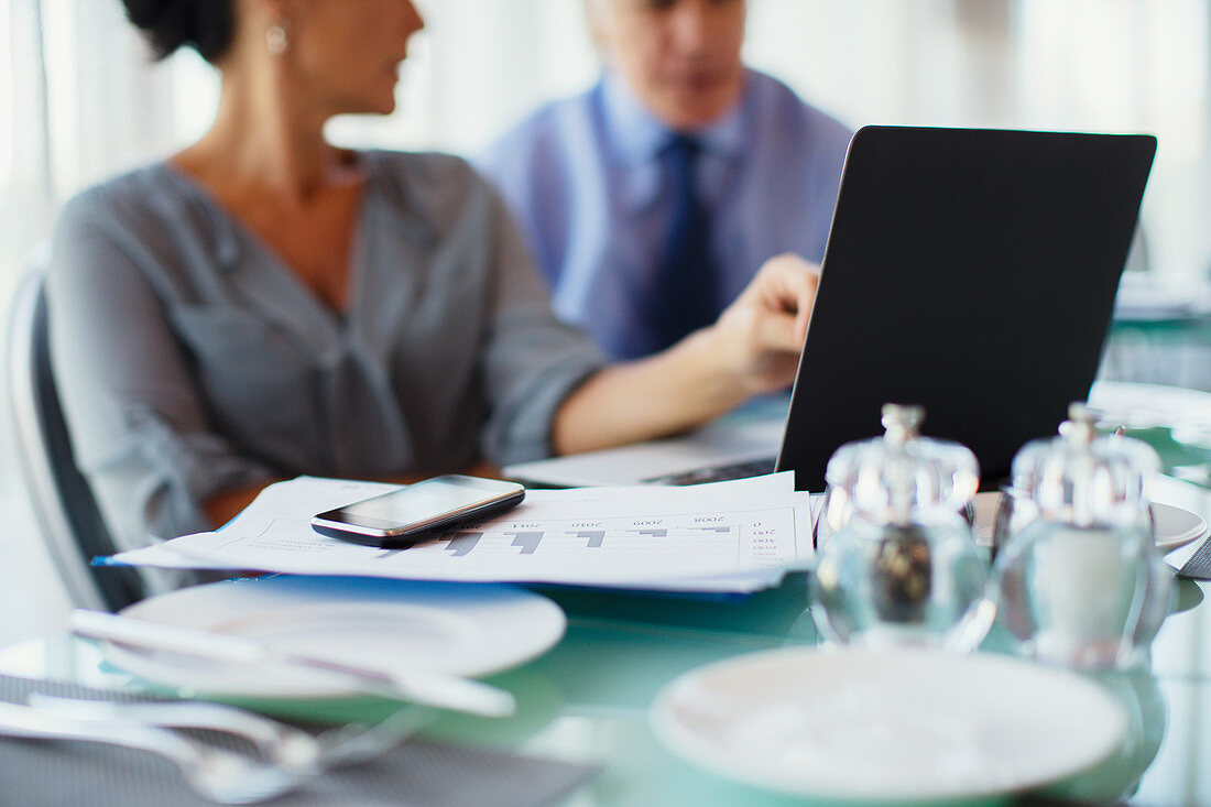 Business woman pointing to laptop screen