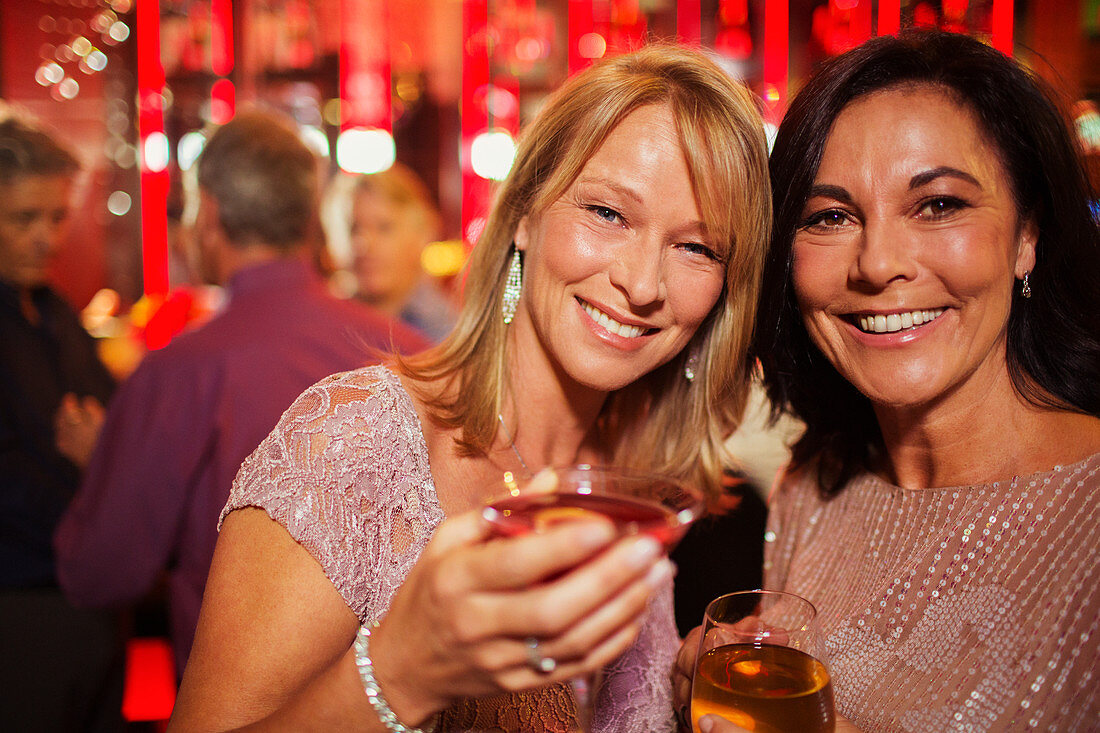 Mature women enjoying drink in bar