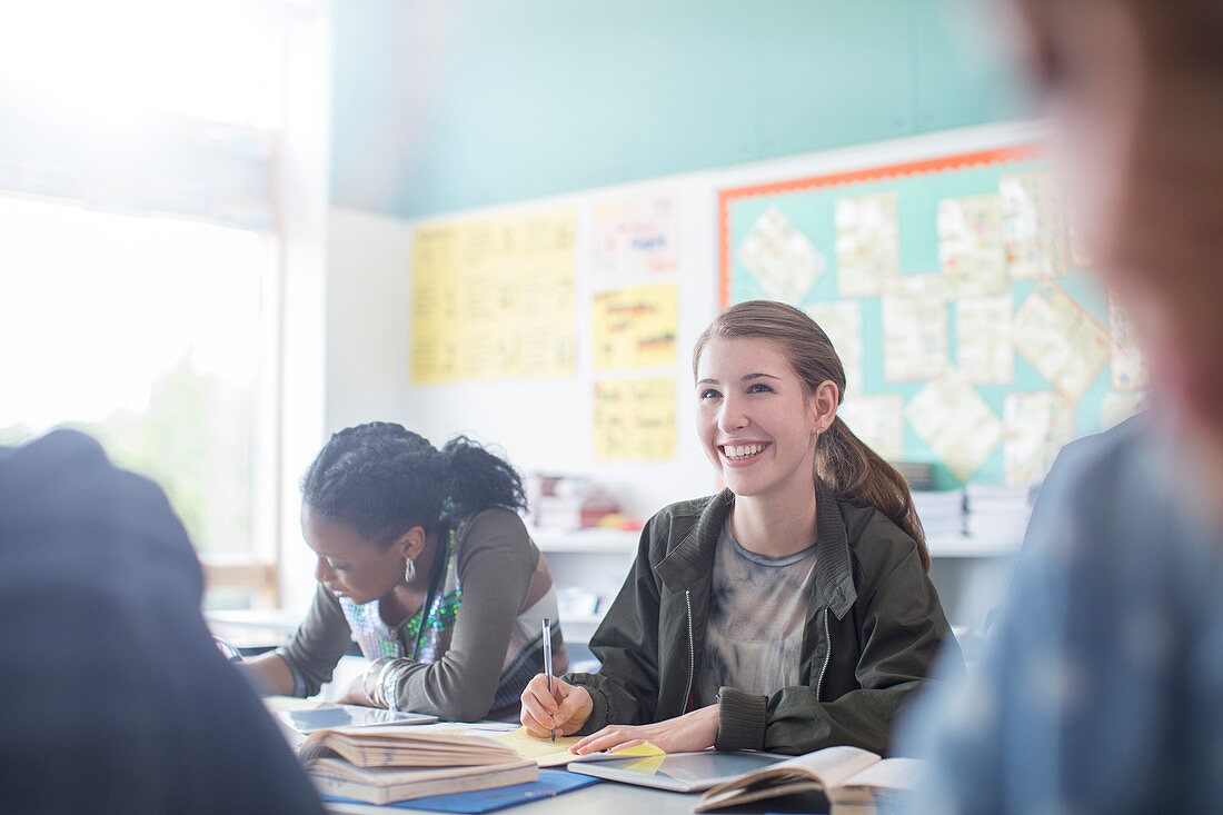 Teenage students learning in classroom