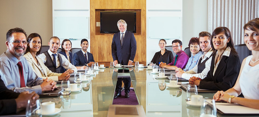 Business people posing in conference room