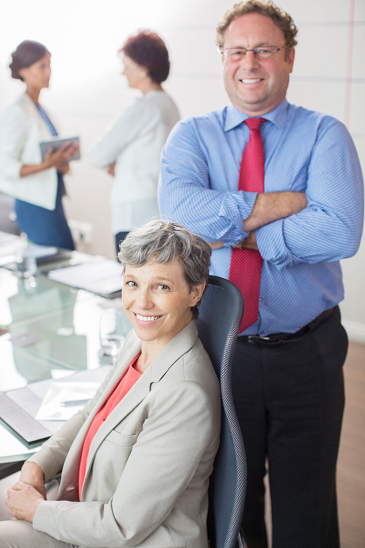 Business people, smiling