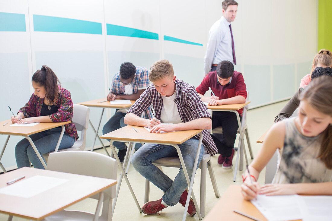 Students writing their GCSE exam