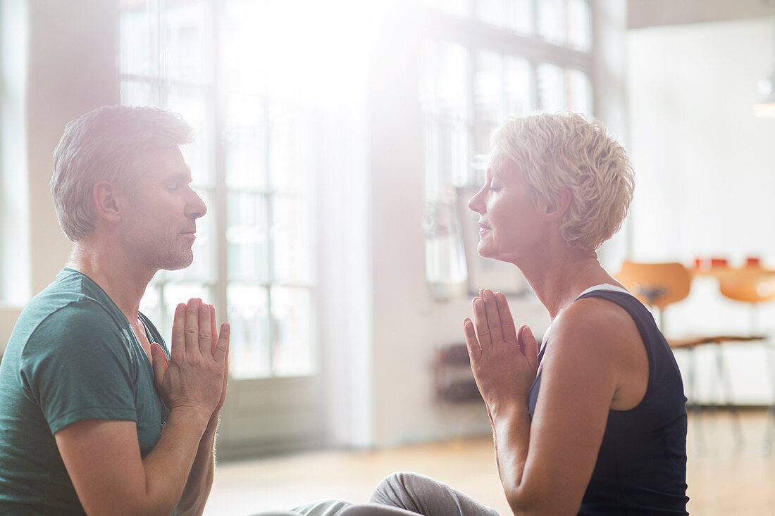 Older couple meditating