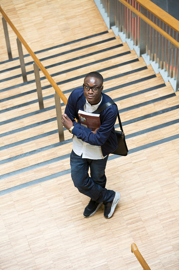 Male student and standing in corridor