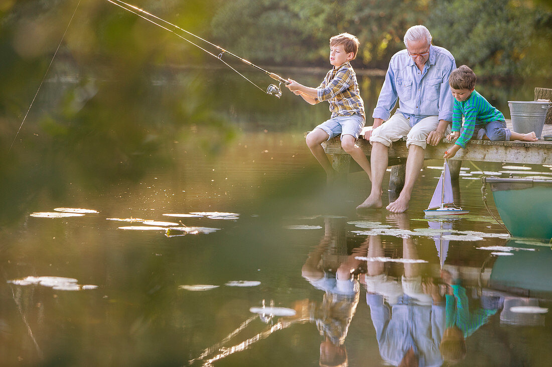 Grandfather and grandsons fishing