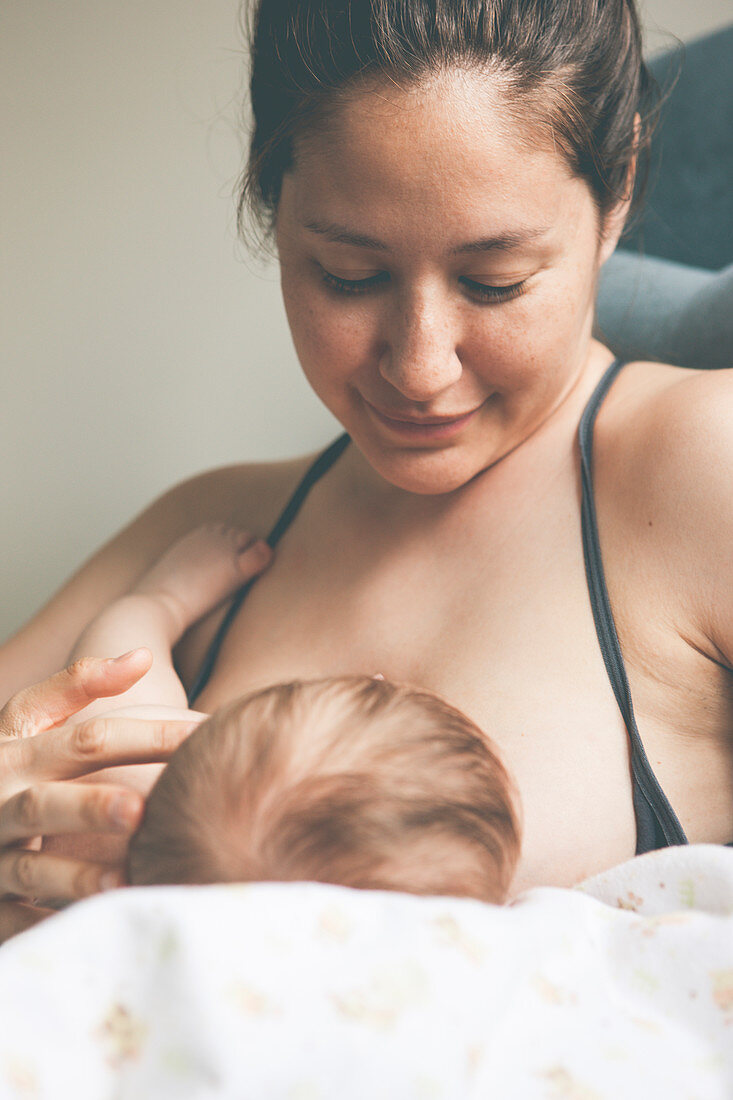 Portrait of mother breast-feeding