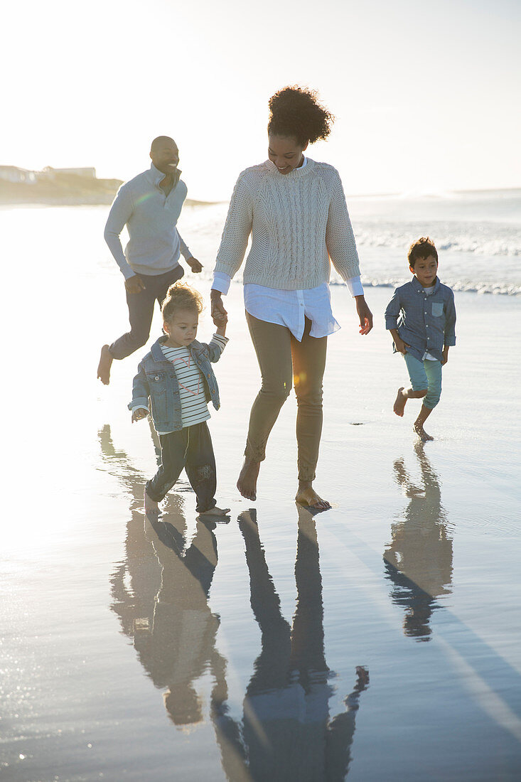 Happy family having fun on beach