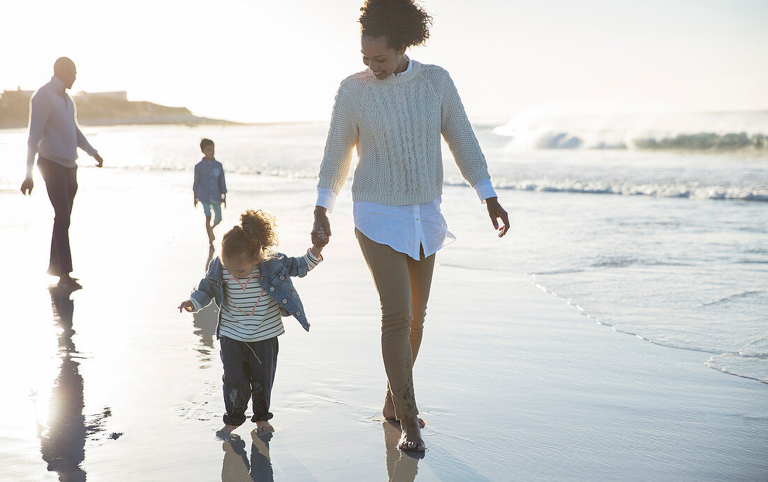 Happy family having fun on beach