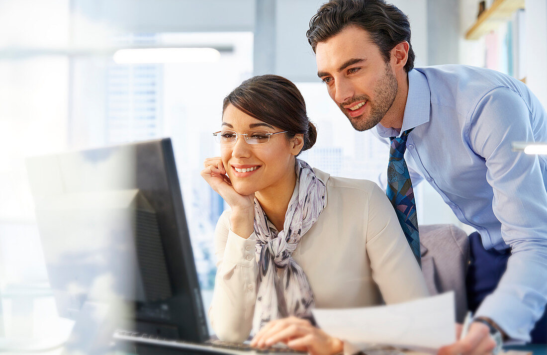 Man and woman working together in office