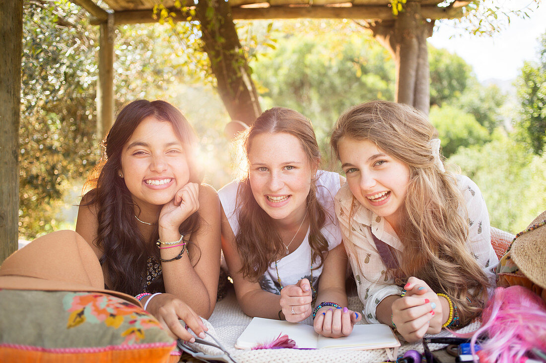 Girls having fun in tree house in summer