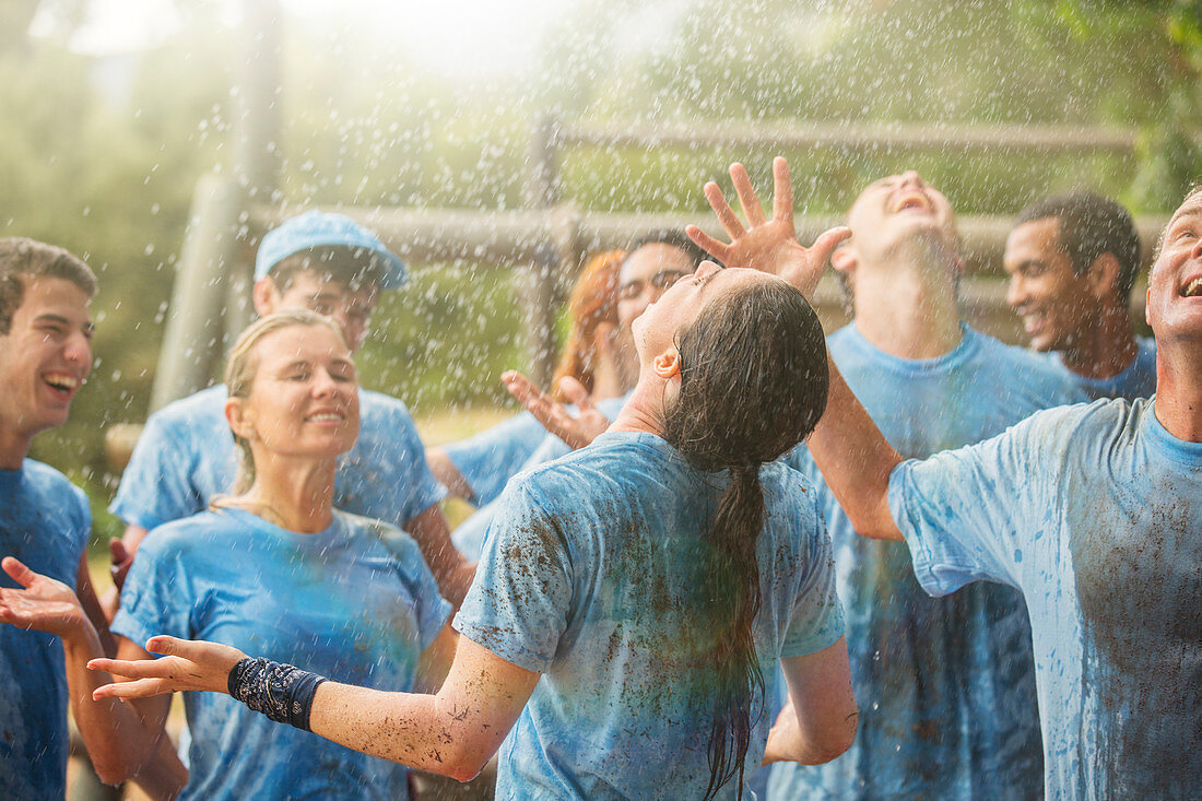 Enthusiastic team enjoying rain