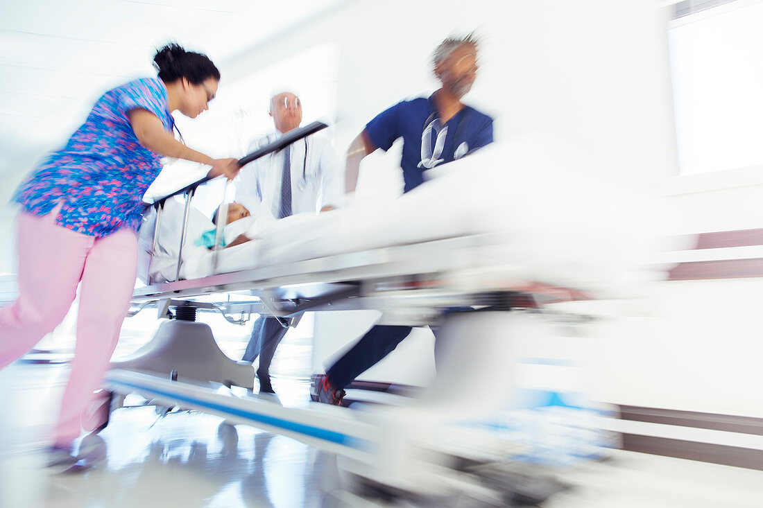 Doctors and nurse rushing patient