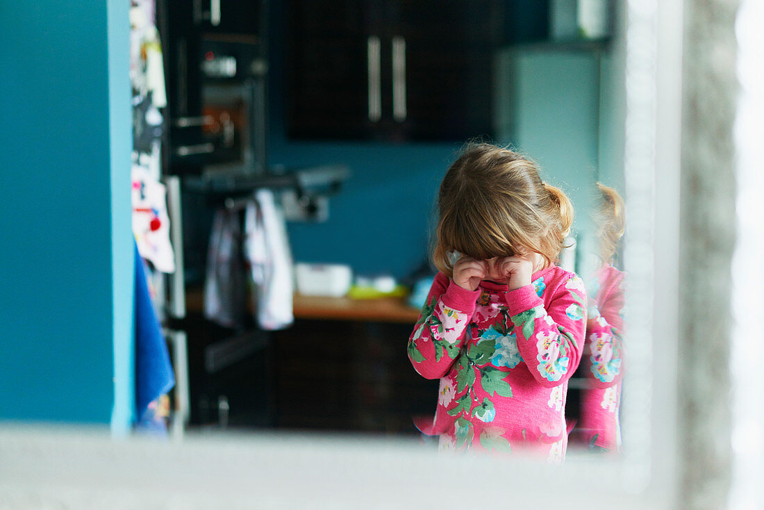 Reflection of upset girl