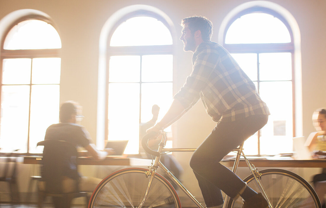 Businessman riding bicycle