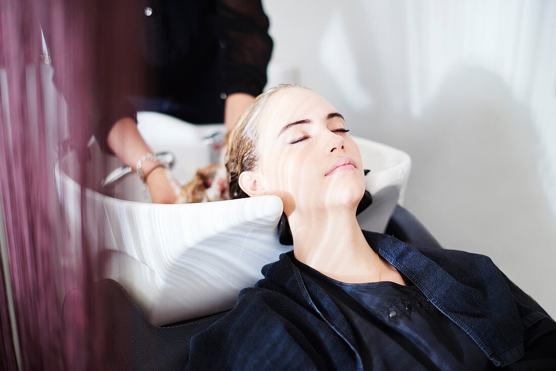 Customer with eyes closed in salon