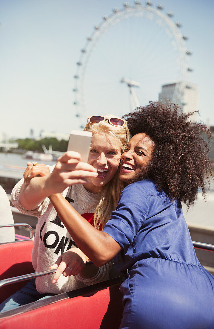 Enthusiastic friends taking selfie