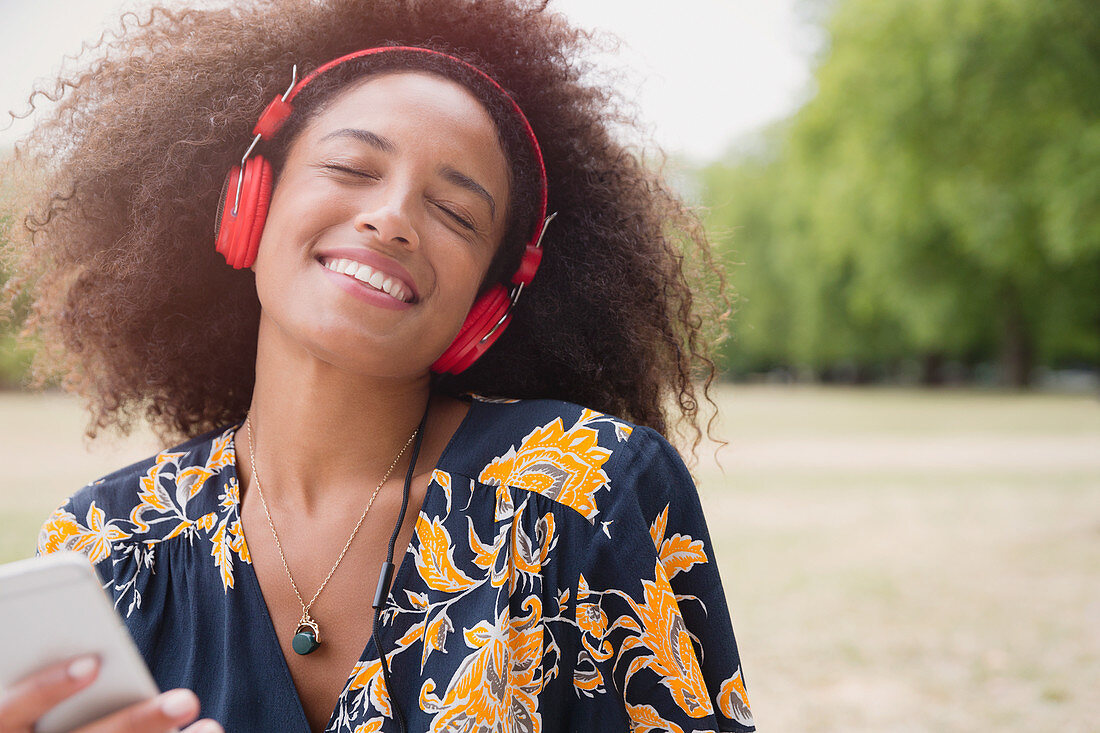 Woman listening to music and mp3 player
