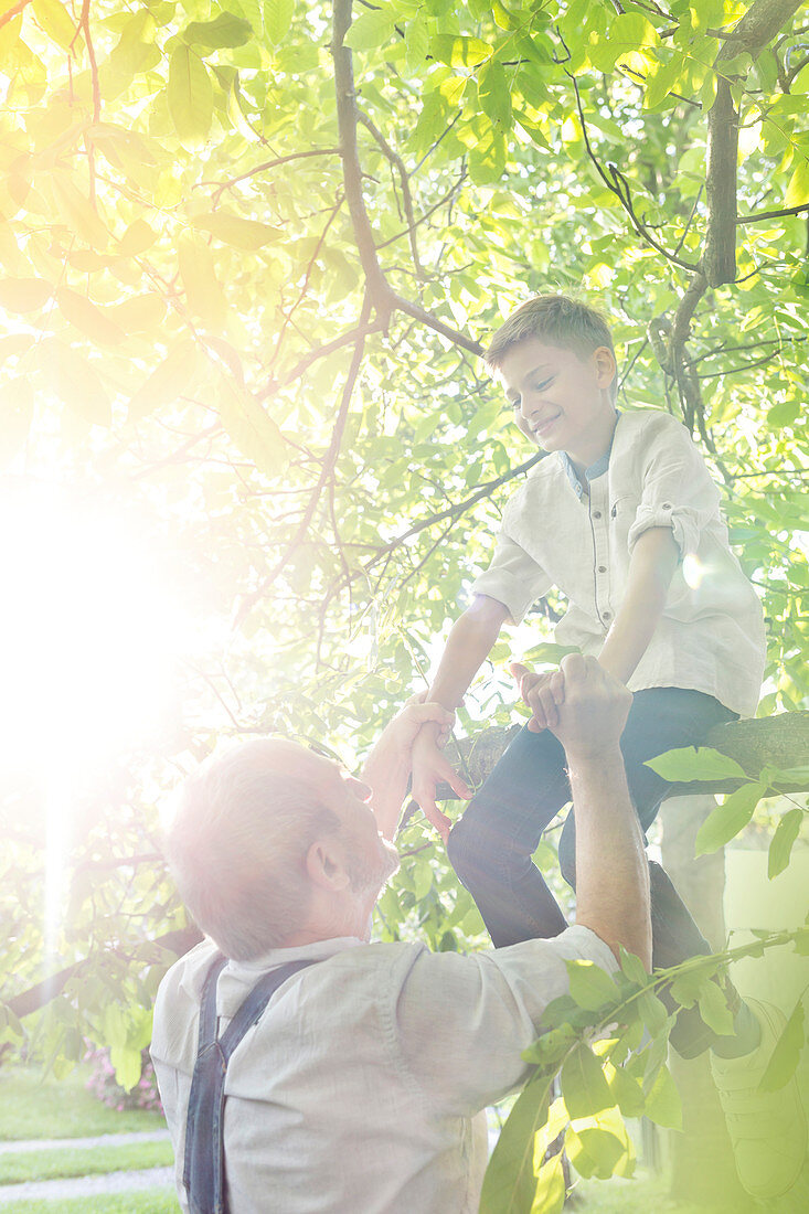 Grandfather helping grandson