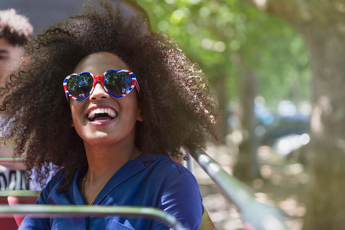Woman with afro wearing glasses