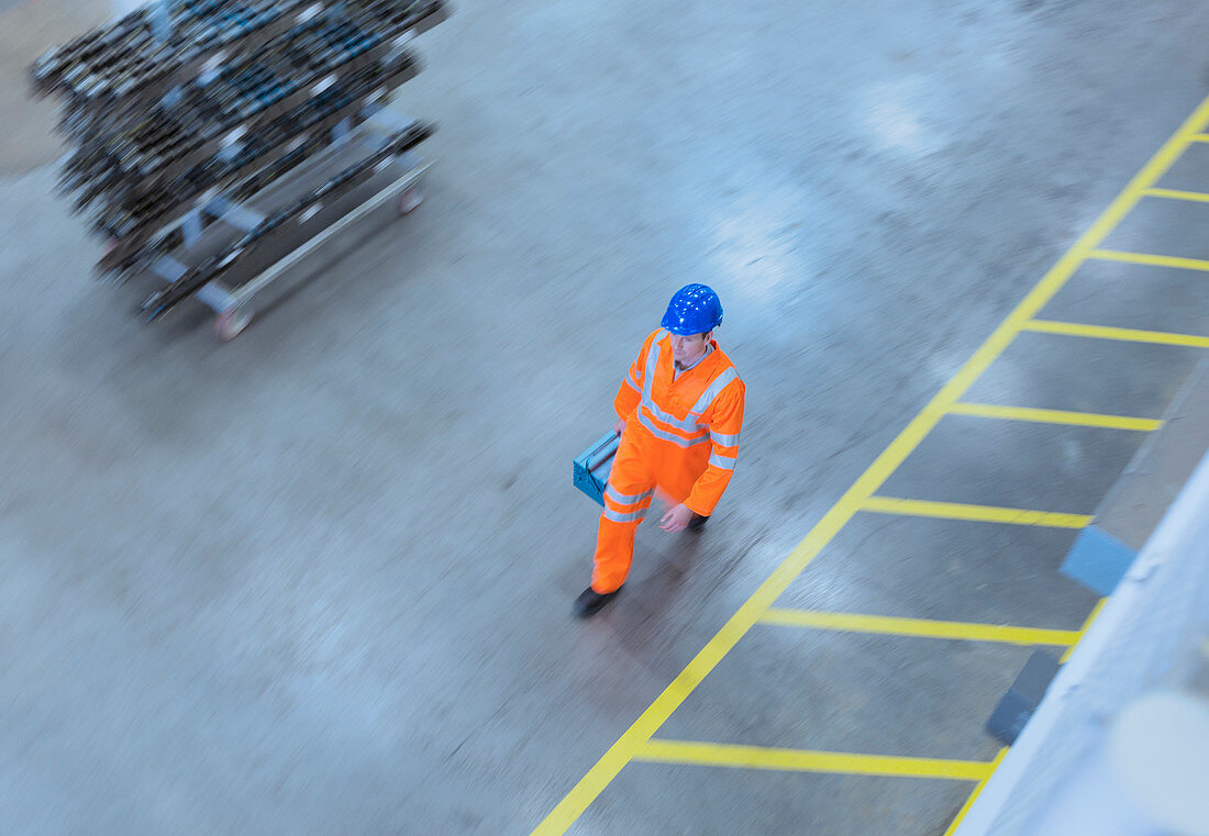 Worker walking with toolbox