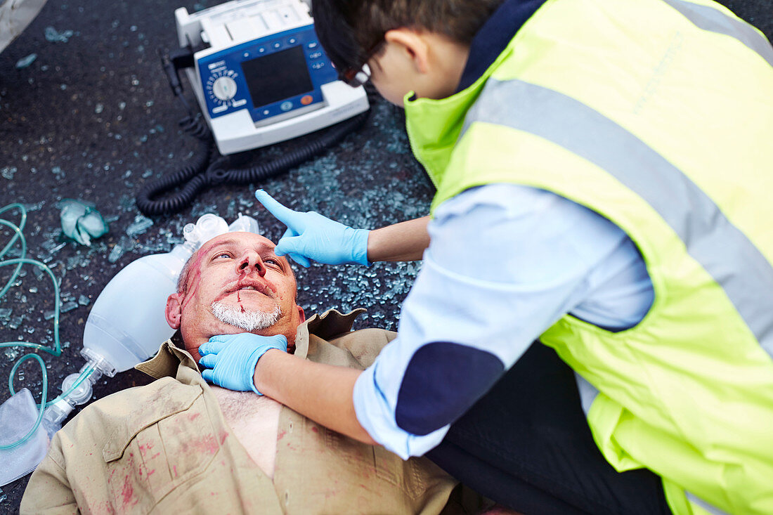 Rescue worker tending to accident victim